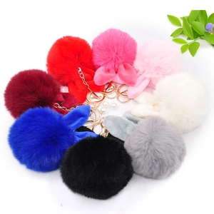 Colorful rabbit ear faux fur pompom keychains with gold clasps and pearl accents