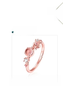 Detail of rose gold plated open ring featuring pink quartz and intricate rose flower motif