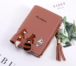 Close-up of pink PU leather wallet with cute animal embroidery and matching tassel