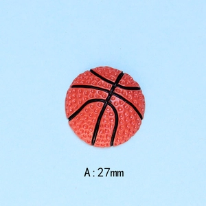 Detail view of 27mm resin basketball flatback charm with textured surface for DIY crafts
