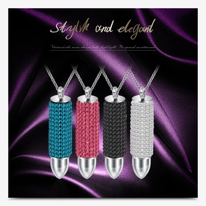 Macro detail of bullet pendants with colorful crystals and polished stainless steel finish