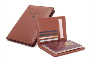 Detail view of brown leather RFID passport wallet with multiple card slots and cash pocket