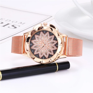 Elegant rose gold women's watch featuring a crystal flower dial and mesh metal strap