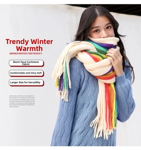 Close-up of soft rainbow striped cashmere-like scarf with fringe details and thick texture