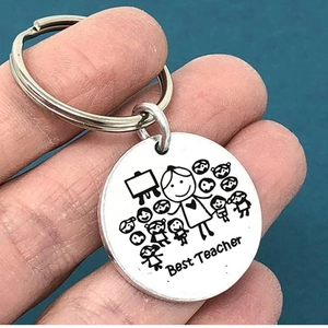 Silver stainless steel Best Teacher keychain with engraved cartoon figures held in hand