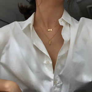 925 silver double layer necklace with gold lock and key pendants on a model