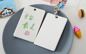 Detail of white DIY plastic card holder with cute sun graphic and Chinese hand lettering