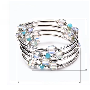 Multilayer wrap bracelet featuring natural square crystals and silver beads on white background