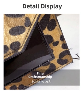 Close-up of leopard print pony hair texture and black patent leather with fine stitching