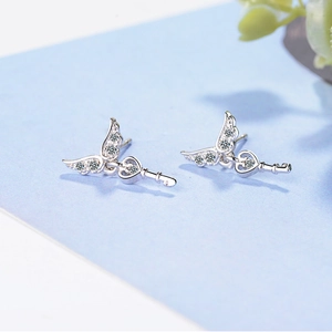 Silver angel wing stud earrings with heart-shaped key pendants and white zircons