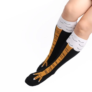 Detail shot of creative chicken feet patterned over-the-knee cotton socks in black