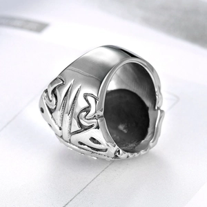 Men's stainless steel ring featuring vintage tribal carvings and a polished silver finish