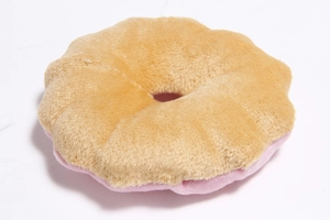 Detail of doughnut-shaped pet plush toy with soft light brown and pink coral fleece fabric