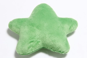 Detail showing soft green plush star toy with visible stitching and plush texture