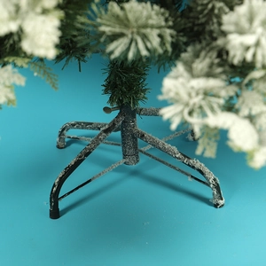 Flocked artificial Christmas tree with snow-covered branches and stable metal base stand