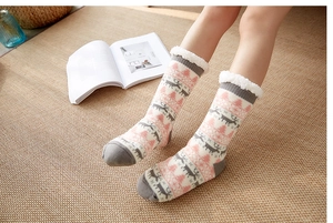 Pink and grey Christmas floor socks with reindeer pattern and warm fleece lining