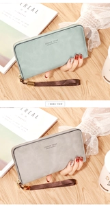Close-up of long zip wallets in mint green and grey with woven wrist straps and gold zippers