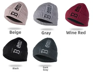 Close-up of five colorful knitted beanies with thick fleece lining and B emy lettering