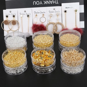 DIY jewelry making kit with gold and silver earring hooks and open rings in a plastic box