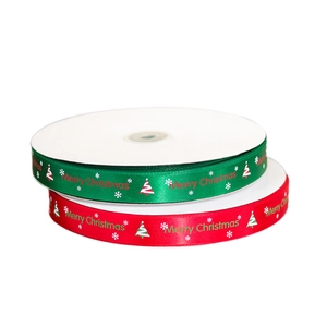 Red and green Merry Christmas satin ribbons with snowflake patterns for gift wrapping