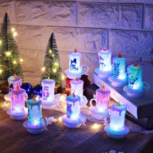 Detailed view of LED Christmas candles with snowman and Santa patterns on a festive backdrop