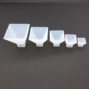 Five assorted sizes of translucent pyramid silicone molds for DIY resin casting projects