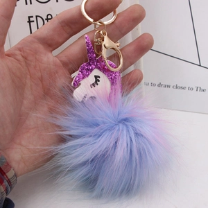Cute faux fox fur unicorn keychain with blue pink gradient pompom and golden metal hardware