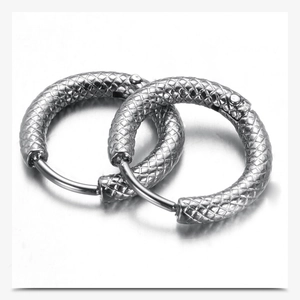 Close-up of 3mm silver stainless steel hoop earrings with textured diamond pattern