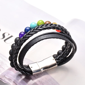 Detail of multi-layer braided leather bracelet with colorful stones and silver magnetic clasp