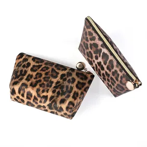 Three-piece leopard print makeup bag set with gold metal zippers and trapezoid shape
