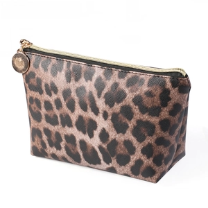 Detail of cross-grain leopard print makeup bag with premium gold zipper and round puller