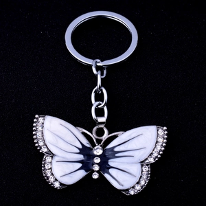 Vintage butterfly keychain with white and black enamel and sparkling rhinestones