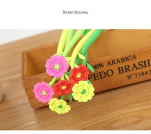 Close-up of creative camellia flower pens with colorful silicone petals and green stems