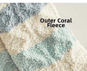 Detailed close-up of soft coral fleece material with blue and white stripes texture