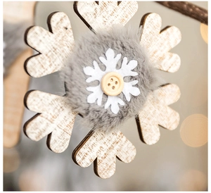Close-up of wooden snowflake ornament with soft plush faux fur and felt layer detail