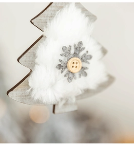 Detail of wooden plush Christmas tree ornaments with felt snowflake and button accents