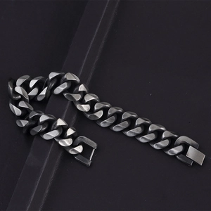 Sleek gunmetal Cuban link bracelet in matte titanium steel with secure clasp closure