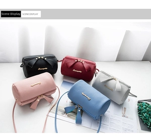 Collection of litchi pattern cylinder bags in five colors with bow detail