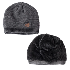 Detail view of winter knitted hat featuring thick fleece lining and maple leaf leather patch