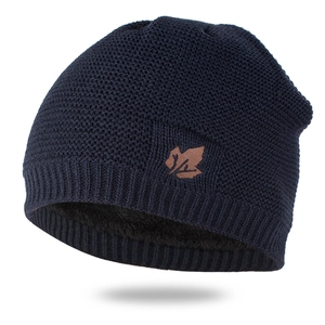 Detail of dark blue knit hat showing thick black fleece lining and maple leaf patch