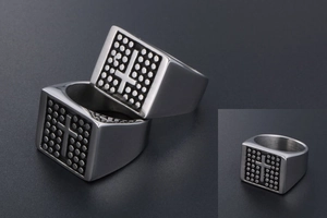 Macro shot of retro square cross signet ring with vintage dot texture for men