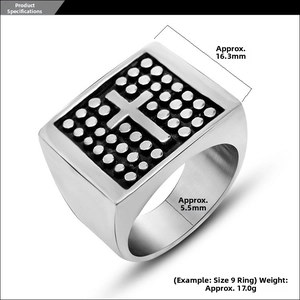 Macro view of men's silver stainless steel square ring with cross pattern and dot texture