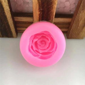 Top view of a pink silicone rose flower mold for DIY fondant and chocolate cake decoration