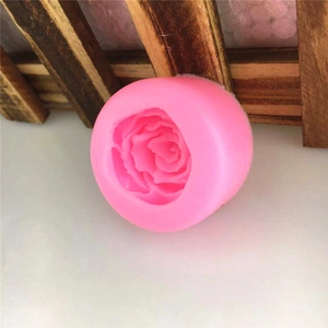 Macro view of a pink silicone rose flower mold for DIY cake decoration and candles
