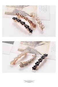 Detailed close-up of a 3-piece elegant hair clip set with pearls and crystals on gold alloy