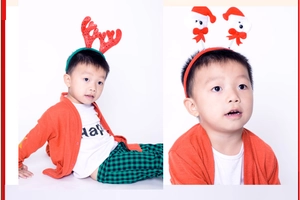 Detail of child wearing glowing reindeer antlers and Santa Claus spring headband