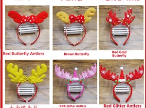 Detail showing various Christmas headbands with sequins and reindeer antlers for parties