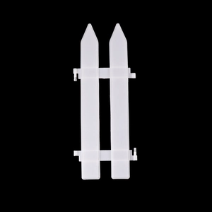 White plastic Christmas tree picket fence panel with interlocking clips for holiday decor