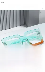 Detail of teal and amber square gradient frames with precision metal hinges