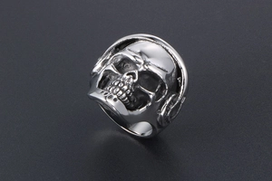 Detail view of punk skull ring with headphone motif in vintage silver steel finish
